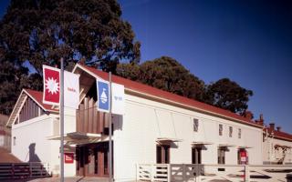 The Bay Area Discovery Museum campus in Sausalito, a nationally recognized children’s museum, has been renovated and expanded to sensitively integrate a new theater building and exhibit areas within the historic context of Fort Baker.